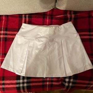 2 Tennis skorts that has 2pockets in the shorts,drawstring waist.1-Small 1-Large